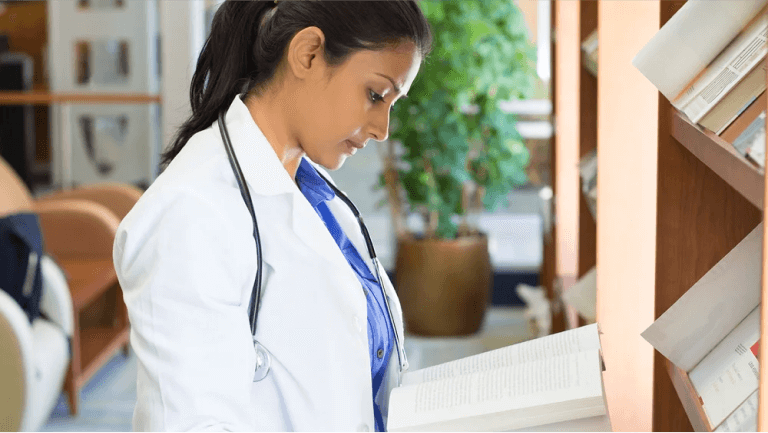 Doctor reading a book