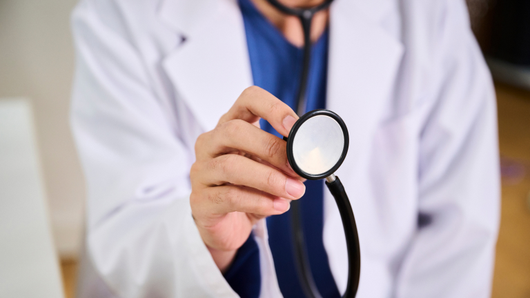 Doctor holding stethoscope