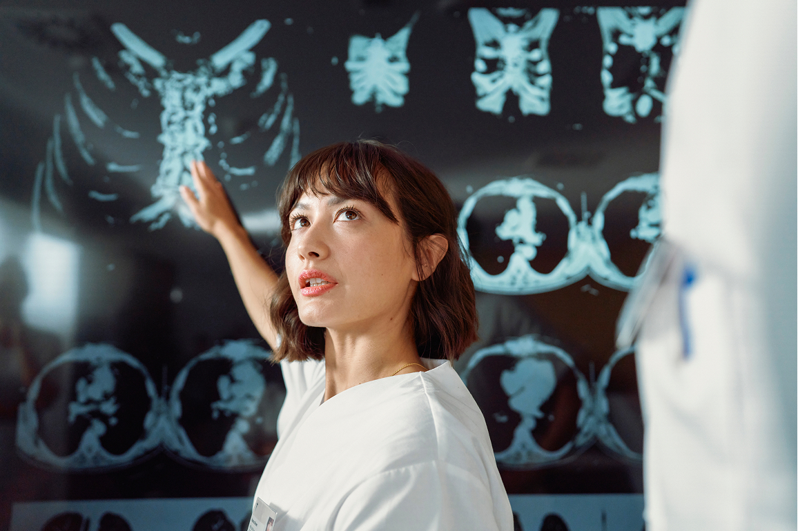 Doctor Pointing Out Specifics of X-Ray Doctor Pointing Out Specifics of X-Ray