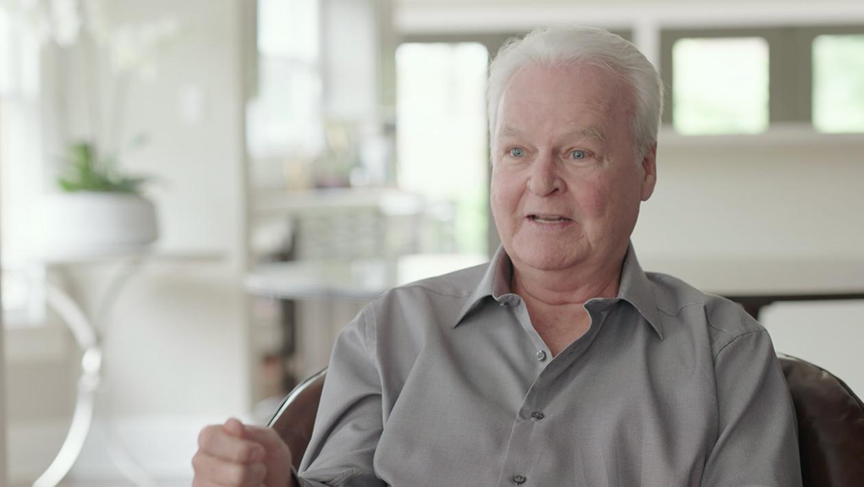 professor seated in an interview explaining the spikes model